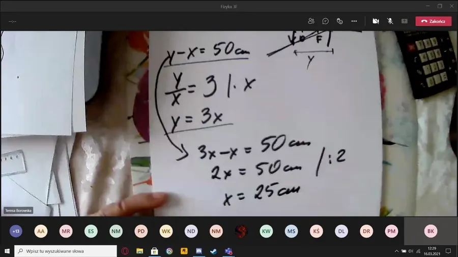 An online maths lesson: handwritten equations held up to a webcam, with students’ video tiles below